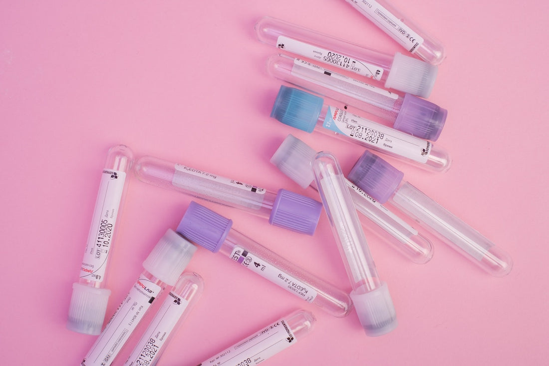 An arrangement of different colored blood collection tubes with their caps and labels visible, showing the variety of tube types available for clinical use.